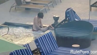 Amateur couple caught fucking in hotel pool