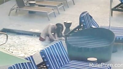 Amateur couple caught fucking in hotel pool