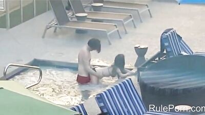 Amateur couple caught fucking in hotel pool