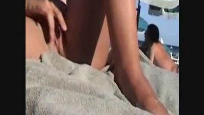 Masturbates on public beach