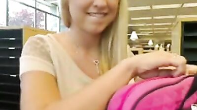 Blonde teen masturbates in the library