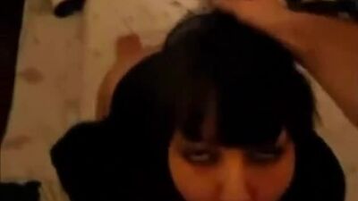 Dark haired babe gives a blowjob