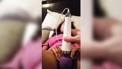 Using purple vibrator to masturbate