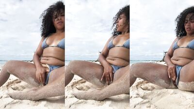 Sexy big boobs black bitch masturbates at the beach 