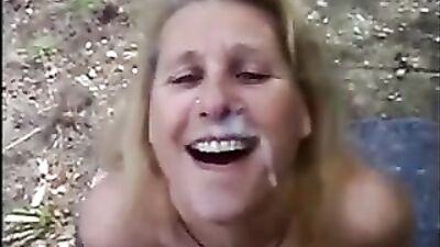 Mature blonde lusty lady sucking fat cock in the forest 