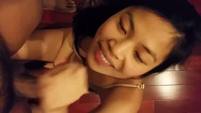 Pretty Asian chick jerking off hard cock 