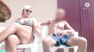 Sexy busty French blonde milf stroking cock by the pool 