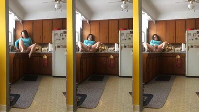 Beautiful chick squirts on the kitchen's counter