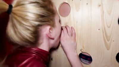 Girl gives blowjobs through holes in the wall