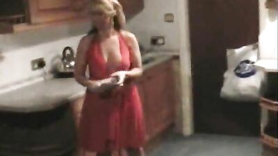 Lynda in hot red dress teasing the camerman with her boobs