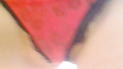 Babe plays with her tits on the living room chair