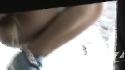 Busty babe's ass in lace panties reflected in the mirror