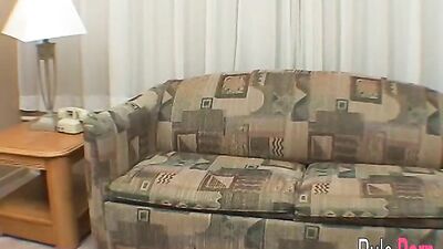 Judy fucks herself with a phone on the couch