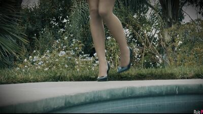 Jillian Janson fucks her pussy with her fingers on the poolside