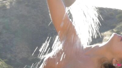 Scarlet Red fucks her pussy with a dildo in the great outdoors