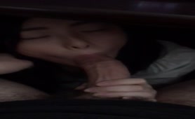 Sexy asian sucking his dick under the desk