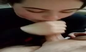 Dark haired beauty gives sexy blowjob