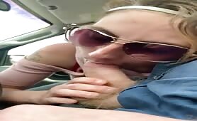 Slutty blonde whore sucking cock in the car